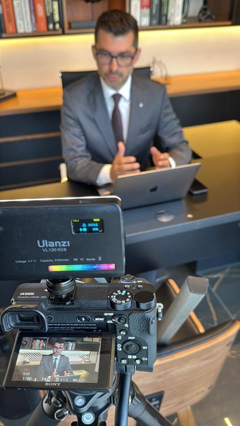Professional man in business attire speaking during video recording